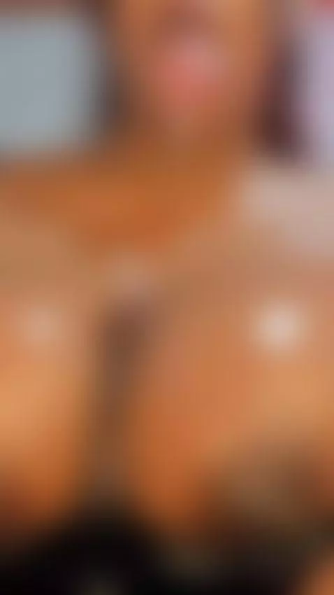 a very pleasurable titjob with my huge, dark, oil-covered br... by firemorocha1