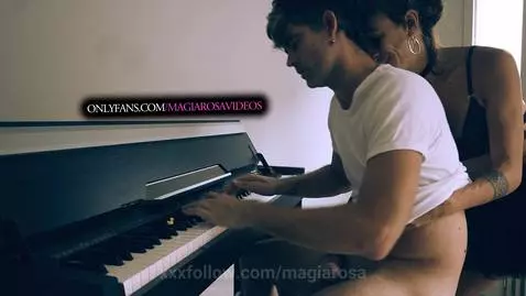 He is playing the piano and I try to bother him by magiarosa