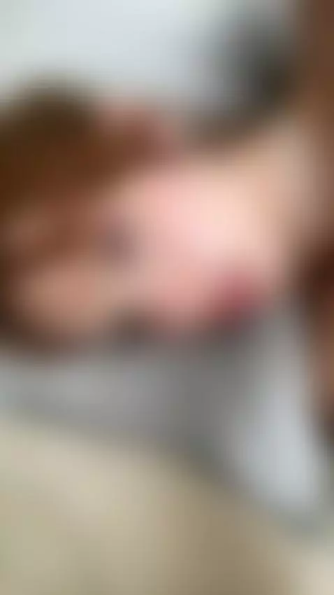 18+ Seductive redhead nude, parted lips on pillow. by adelka2003