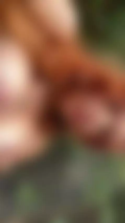 18+ Redhead's perky nude tits teasing outdoors. by adelka2003