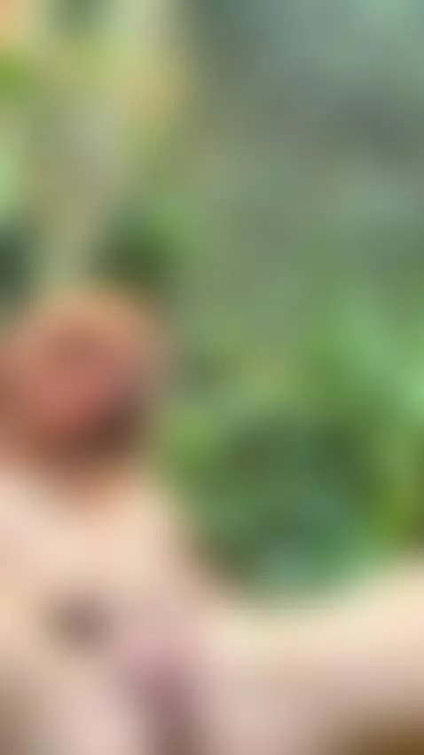 18+ Redhead nude fingering wet pussy in lush garden. by adelka2003