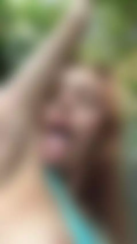 18+ Sexy redhead teases tongue out, perky tits in blue. by adelka2003