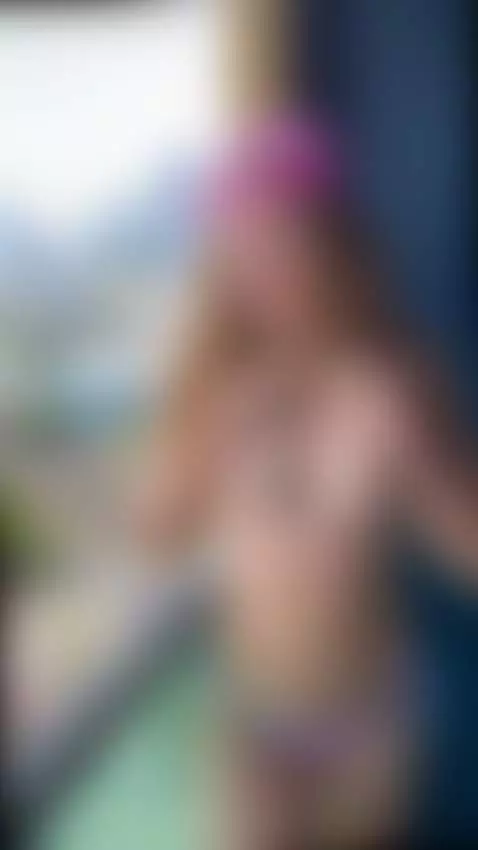 Blonde in pink cap teases on balcony 😘 by gingertee