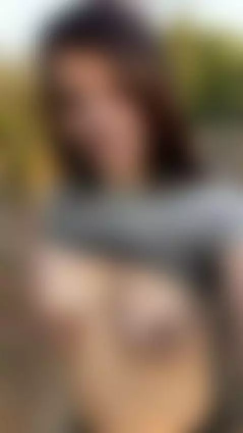 18+ Sexy brunette flashes perky nude tits outdoors. by karawaves