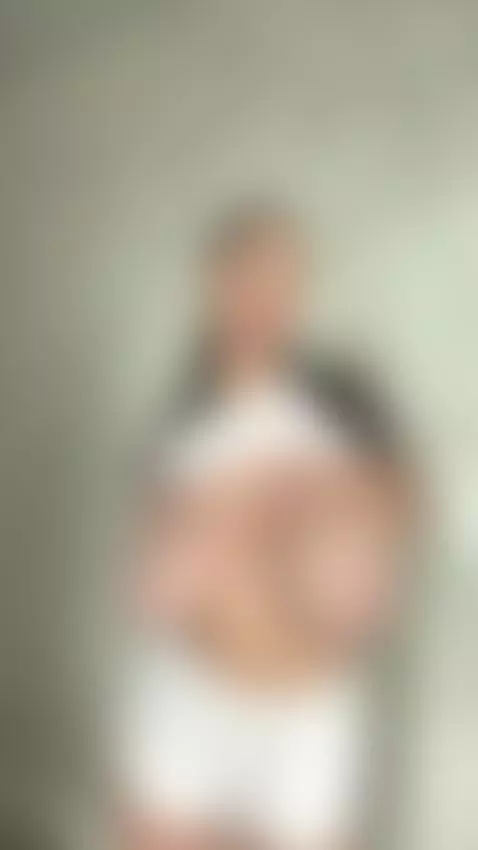 18+ Busty beauty teasing huge tits in tight white top. by bustyyemma