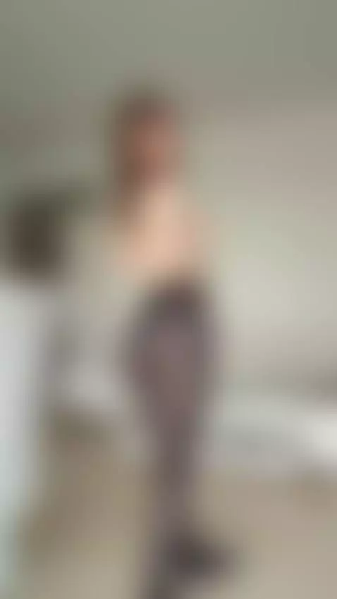 Slender brunette poses topless in sheer black pantyhose by katequinnxxx