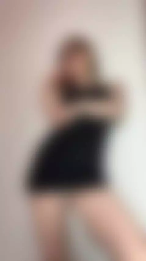 Cute brunette in a tight black mini dress teasing with her h... by katequinnxxx