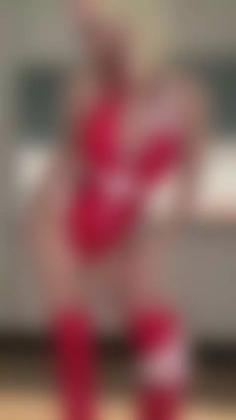 Blonde teasing in red vinyl bodysuit and boots by alexagreyforyou