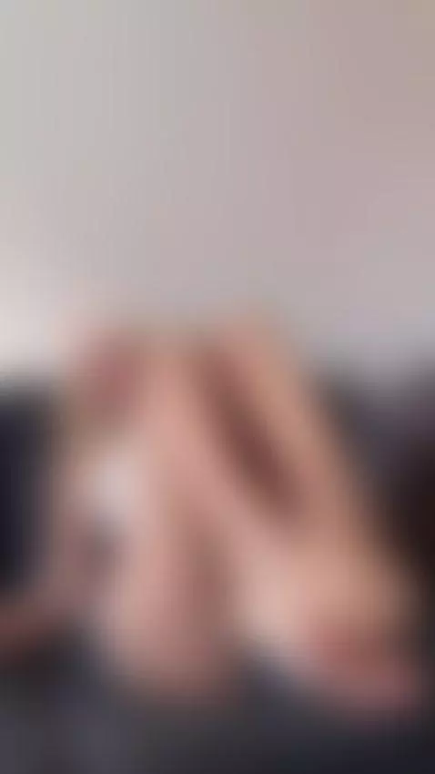 Blonde beauty lounging on the couch flaunting her soles by alexagreyforyou