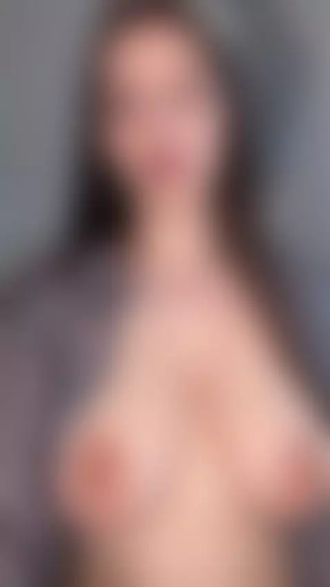 She squeezes her full breasts while staring straight into yo... by emmyelfie
