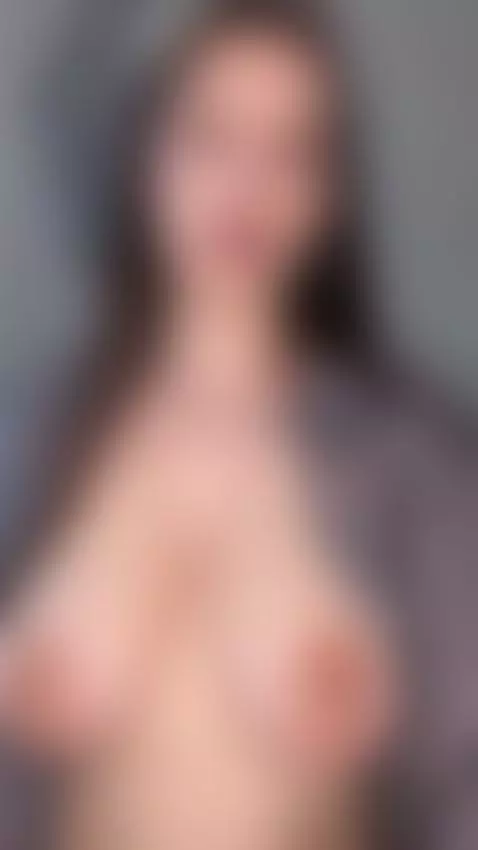 She holds both full soft tits close together in an open gray... by emmyelfie