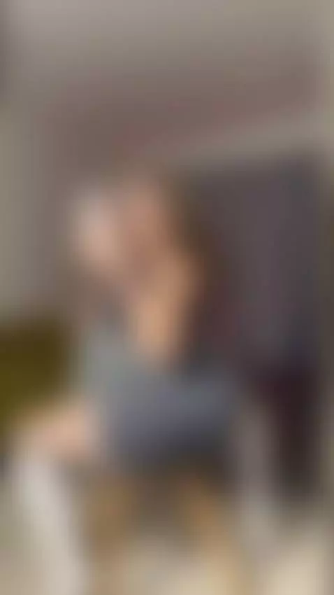 Curvy hips press into chair as she leans back by ivaberg