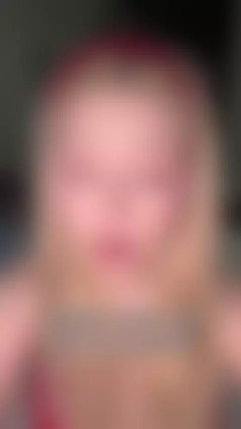 Blue eyes locked on camera, lips parted soft by missfrogg
