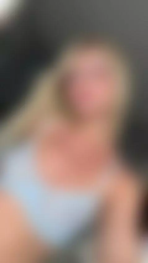 Blonde tease leans forward showing perfect tits by emily-lu