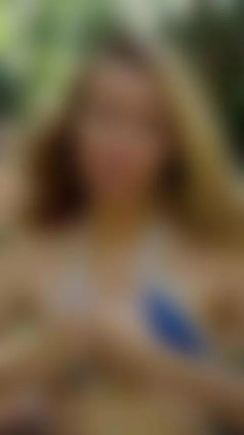 Blonde hair frames her face as she tugs her top down 😇 by ellynextdoor