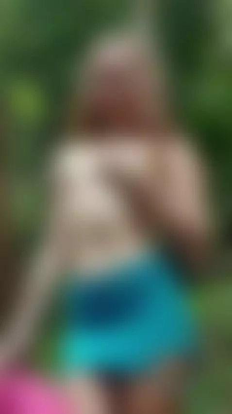 Tattooed side bare as she tugs her skirt low in the jungle by ellynextdoor