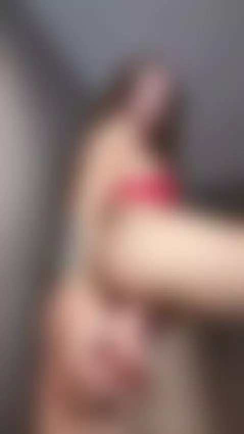 Looking down at close up of in red lingerie and fingers near... by allisonarg