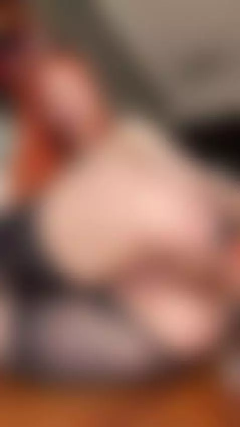 Sexy redhead lying back and teasing her pussy with a naughty... by sofiarivers