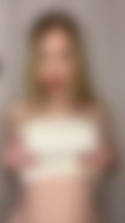 Blonde wearing strapless white top holding her chest 💦 Onlyf... by blondydollies