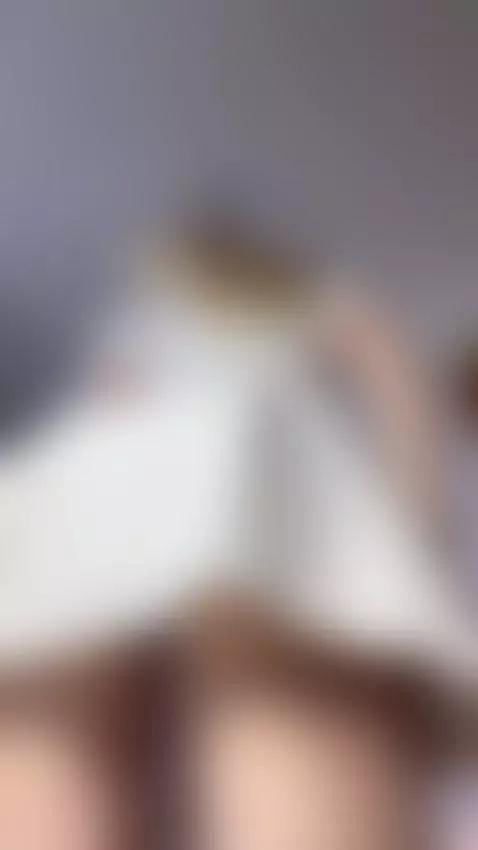 Playful tease in a white sundress by elliefaye