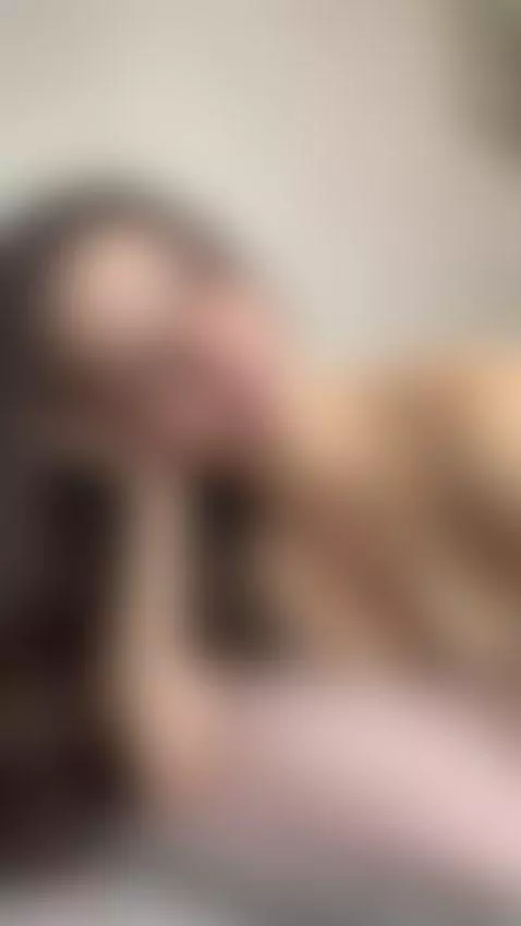 Beautiful brunette relaxes topless on her bed by creamysin