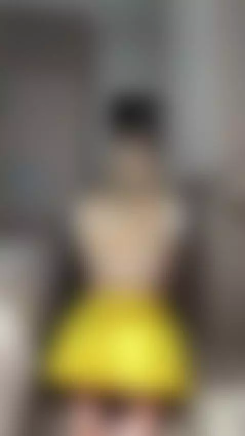 Yellow ruffled skirt flipped up from behind reveals her bare... by monicamon