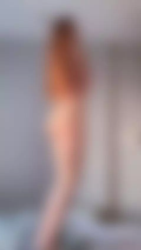 Long legs spread slightly as she bites her lip looking back ... by aalisaa