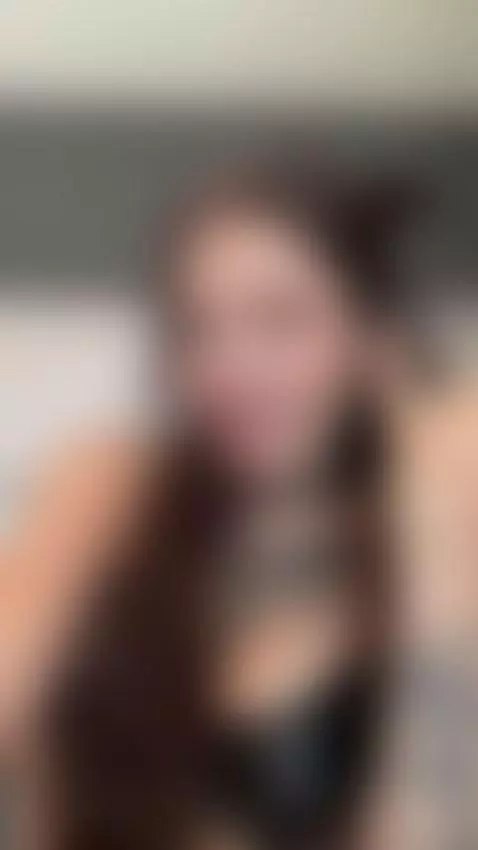 Tattooed chest and black top as she points at her lips 🤤 by femdommissdi