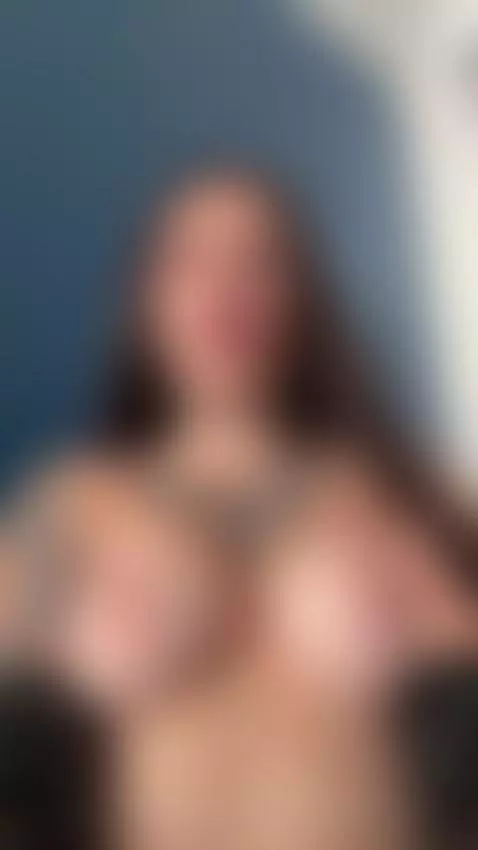 Tattooed chest on display as she bites her lip 😇 by femdommissdi
