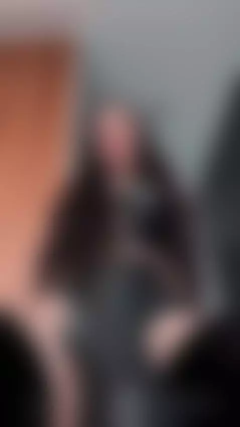 Leather-clad legs spread wide, she owns your gaze 🤤 by femdommissdi