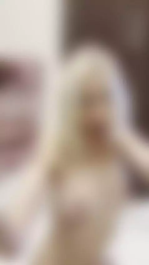 Blonde hair frames her face as she sticks her tongue out 🍆 by tiny-fawn