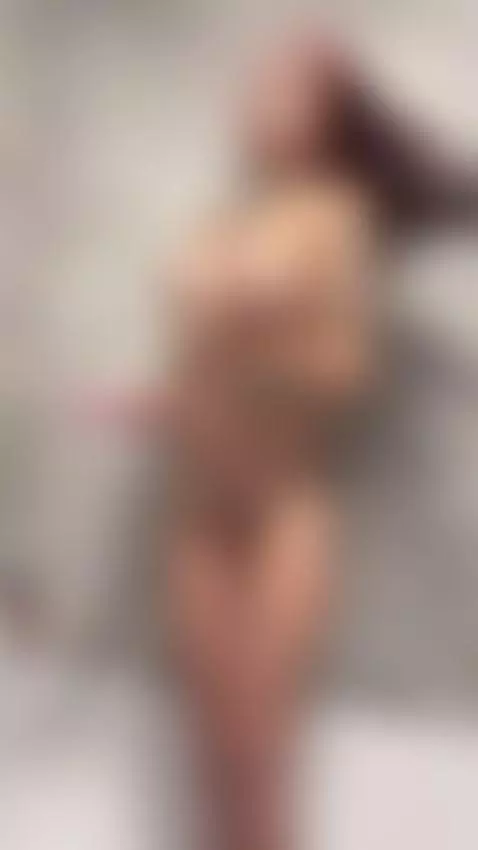 Oiled-up redhead stands in the shower and runs her hands ove... by ohhnaomi