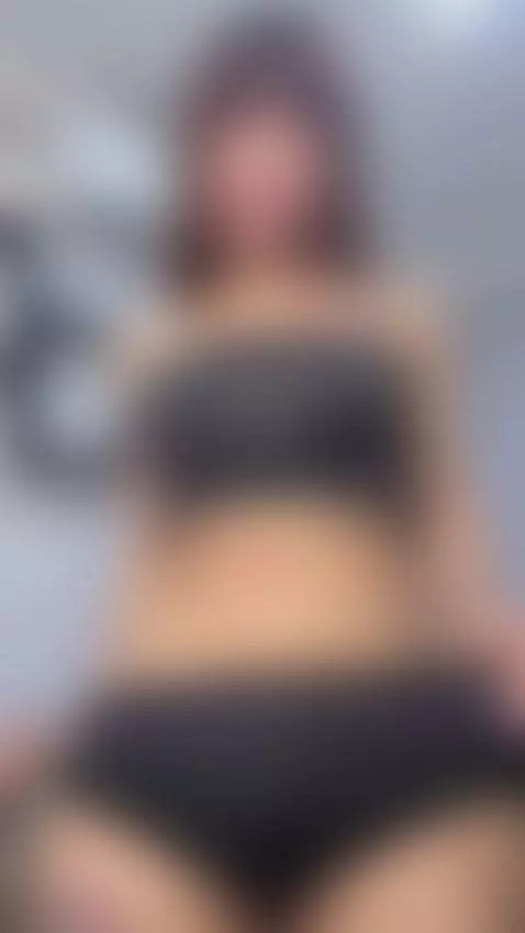 Tattooed girl slowly pulls her shorts down and stares hard by noemits