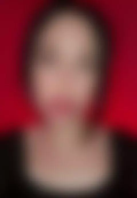 She stares hard with lips parted, red backdrop behind 🤫 by sofits