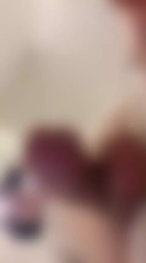 Trans girl smiles up at the camera, cock glistening close to... by femmbaby